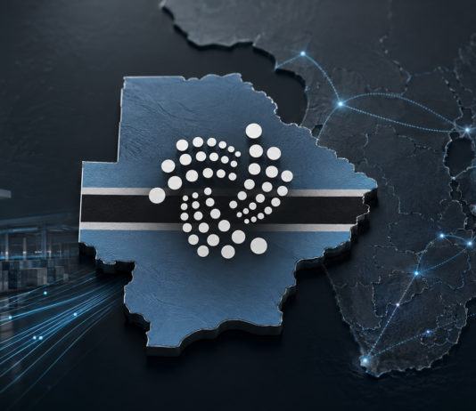 IOTA-Logo auf der Karte Botswanas vor digital vernetzten Handelsrouten in Afrika