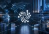 IOTA-Architekt arbeitet an UN-Standard für grenzüberschreitende Handelsdaten IOTA-Symbol vor einer Weltkarte, Handelswegen und dem UN-Emblem