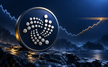 IOTA vor 42-Prozent-Rallye? Diese Kursmarken werden jetzt wichtig IOTA-Logo auf einer dunkelblauen Münze vor einer symbolischen Kurslinie, die nach einem Rückgang bis an einen Widerstand steigt.