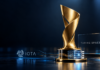 IOTA-Projekt räumt in den Niederlanden ab – der nächste Preis winkt Symbolische Trophäe mit Turing-Space-Schriftzug und IOTA-Emblem vor dunkelblauem Hintergrund