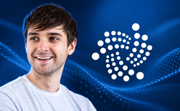 Illustration von Dominik Schiener neben dem IOTA-Logo vor blauem Hintergrund