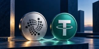 IOTA: USDT0-Nutzung explodiert – 96 % landen auf neuer Perp-DEX Silberne Münze mit IOTA-Logo neben einer grünen Münze mit Tether-Symbol, verbunden durch eine leuchtende Linie.