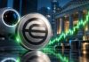 Sam Altman’s World stellt neues Bankenprodukt vor – WLD-Kurs steigt 10% in 24h Worldcoin-Symbol vor modernem Bankgebäude und biometrischem Scanner, begleitet von einem grünen Aufwärtstrend als Sinnbild für steigenden Kurs und wachsende Bedeutung im Finanzsektor.